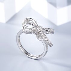 Bowknot Sterling Silver Cocktail Ring - Jeulia Jewelry White Butterfly Knot Jewelry For Wedding, Elegant Bow Ring For Gifts, Elegant Butterfly Knot Jewelry For Wedding, Elegant Bow Ring, Elegant Bow Rings For Anniversary, Elegant Bow Ring For Promise, Bow Ring Jewelry For Gift, White Gold Bow Rings For Wedding, Silver Wedding Ring With Bow Detail