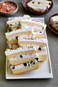 several slices of cake on a plate with sprinkles