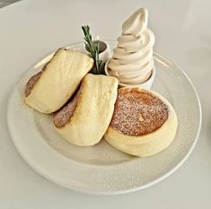 a white plate topped with desserts on top of a table