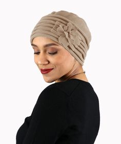 Our new Lauren Luxury fleece beanie hat for women makes a sweet go-to hat for fall and winter. A women's winter fashion hat that's also perfect for chemo patients and women with hair loss. Scroll down for video With full coverage over your ears and neckline and plush velvety-soft fleece to keep your sweet head snuggly warm, it's a perfect chemo hat for fall and winter. Weighing just 2 ounces this single layer, plush fleece hat has 6 pleats around the edge to keep your ears and neckline warm and cozy without being bulky. Upgrade your chemo headwear wardrobe with this stylish, easy-care fleece beanie that's as practical as it is cute. Whimsical fleece flower detail adds a feminine touch to this chic winter beanie. Flower can be worn wherever suits your mood by turning the hat. Flower is not Women's Winter Fashion, Fleece Beanie, Hat Flower, Chemo Headwear, Doctor's Office, Head Coverings, Beanie Hats For Women, Fleece Hat, Chemo Caps