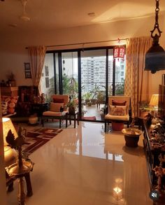 a living room filled with furniture and lots of windows