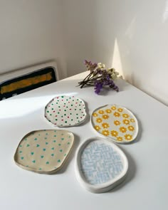 four plates sitting on top of a white counter