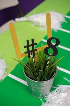 there is a plant that has been placed in a cup with the number eight on it