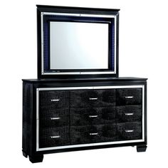 a black dresser with a mirror on top and drawers below it, in front of a white background