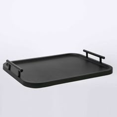 a black tray with two handles on it