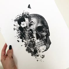 a drawing of a skull with flowers on it