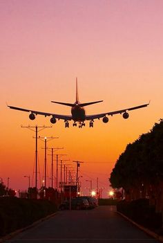 an airplane taking off into the sky at sunset with words that read, let's travel