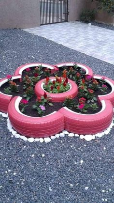 a flower bed made out of old tires