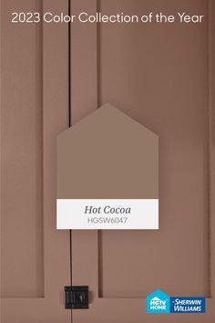 a brown color with the words hot cocoa on it and an image of a house