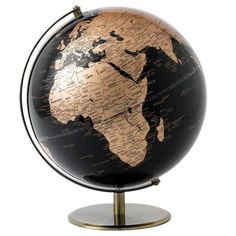 a black and gold globe on a stand with the map of the world printed on it