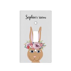 a light switch cover with an image of a rabbit wearing a flower crown