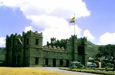 an old castle with a flag on top