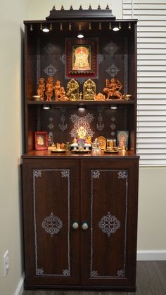 a wooden cabinet with many items on it