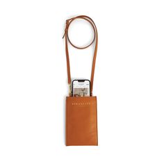 a cell phone in a tan leather pouch