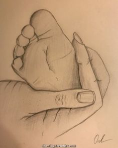 a pencil drawing of a hand holding a baby's foot with the thumb on it