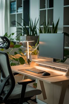 a computer desk with a monitor, keyboard and mouse on it in an office setting