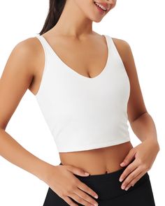 PRICES MAY VARY. ♥MATERIAL of Womens Sports Bras: 80% Nylon,20% Spandex. The Workout Tops Sport Bra is soft, 4-way high-stretch fabric, of moderate thickness and breathable, skin-friendly, lightweight, quick dry, double-sided, Moisture-wicking and on-trend athletic. Workout tank top keeps cool by air circulate, maintains shape and color after wash and activewear. There’s enough underarm room of the elastic crop top for exercise. This long line supportive bra top has a skin-like fit, feels like n Elastic Crop Top, Yoga Workout Clothes, Gym Crop Top, Yoga Tank Top, Supportive Sports Bras, Sports Wear Women, Built In Shelf, Easy Yoga Workouts, Tennis Skirts