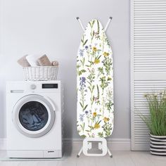 an ironing board next to a washing machine