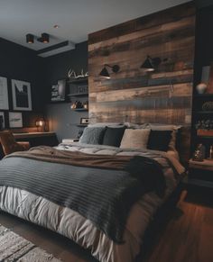 a large bed sitting in a bedroom next to a wooden headboard on a wall