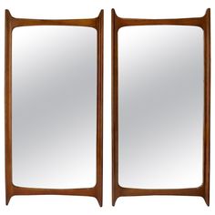 a pair of mirrors sitting next to each other