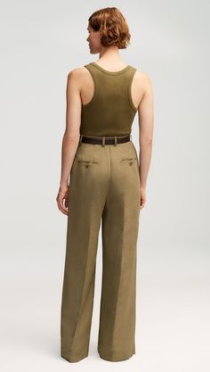 Our slouchy Pleated Trouser is a timeless piece that finds balance in touting both a wide-leg and a slim fit. The pant borrows from traditional suiting with a curtained waistband — which sits at the natural waistline for a flattering appearance — alongside pleated detailing. Fitted Khaki Wide-leg Dress Pants, Fitted Khaki Dress Pants With Wide Leg, Fitted Wide Leg Khaki Dress Pants, Khaki Wide Leg Fitted Dress Pants, Classic Full-length Khaki Pants, Classic Full Length Khaki Pants, Classic Khaki Pants, Khaki Wide-leg Pants For Work, Khaki Wide Leg Pants For Work