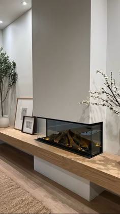 a modern fireplace in the middle of a living room