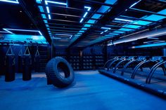 an empty gym with treads and blue lighting