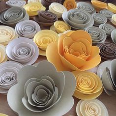 some paper flowers are laying on the table