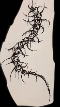 an artistic drawing of vines on the side of a white sheet with black ink in it