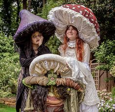 two women dressed up as witches standing next to each other