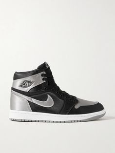 Nike's 'Air Jordan 1 Retro OG' sneakers pay homage to the basketball player's achievements on the court, which earned him the coveted 'MVP' award five times in a row. Designed in a black and silver colorway, they're made from satin with 'Swoosh' logos and have embroidered branding. Modern Black High-top Sneakers With Logo, Black High-top Jordan Shoes For Streetwear, Nike Black High-top Sneakers With Air Cushioning, Black High-top Synthetic Jordan Shoes, Black High-top Sneakers With Reflective Details, Nike Air Jordan 1 Retro, Nike High Tops, Nike Air Jordan 1, Air Jordan 1 Retro