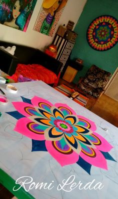 a bed with a colorful flower design on it