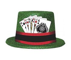 a green glitter top hat with playing cards in the center and black ribbon around the band