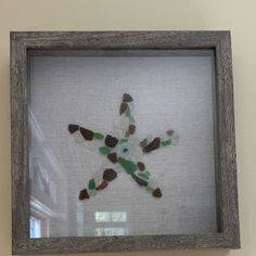 a wooden frame with a glass cut out of a star