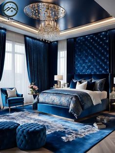 a luxurious bedroom with blue velvet upholstered furniture and chandelier hanging from the ceiling