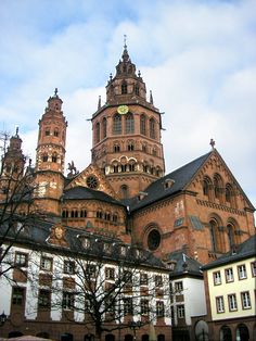 an old building with two towers and a clock on it's face is shown