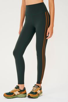 Side view of girl wearing dark green leggings with two thin brown stripes down the side with multi colored shoes Barre Pilates, Yoga Barre, Hot Yoga, Side Stripe, Second Skin, Pilates, High Waist, Honey, Butter