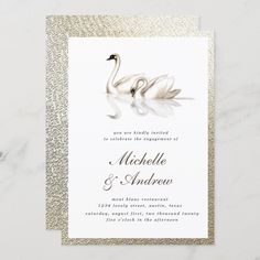 a wedding card with two swans on the front, and gold glitter in the back