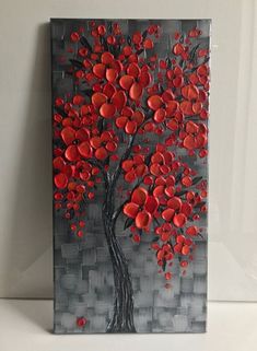 a painting with red hearts on it and a tree in the middle is displayed against a white background