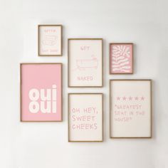 six framed pink and white art pieces on a wall with the words, get out, naked, oh hey sweet in the chees