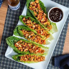 lettuce wraps with chicken and sauce on a plate