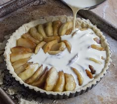 an apple pie is being drizzled with icing on the top and bottom