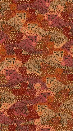 an animal print rug with red and orange colors