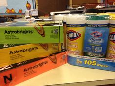 several different types of cleaning products sitting on a table in a store, including detergents and deodorant