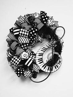 a black and white photo of a wreath made out of musical instruments with polka dots