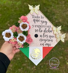 someone is holding up a graduation cap with flowers on the front and side, which reads do you agree? yeseproser se be able to de abreave crepe