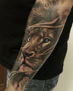 a man with a lion tattoo on his arm