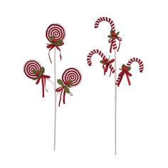 three candy lollipops with bows on them