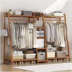 an organized closet with clothes and baskets