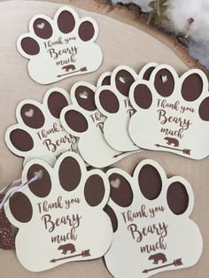 some brown and white paw prints with thank you for being my beary much written on them